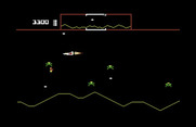 Defender for Commodore 64 - Attempting to rescue a captured humanoid.