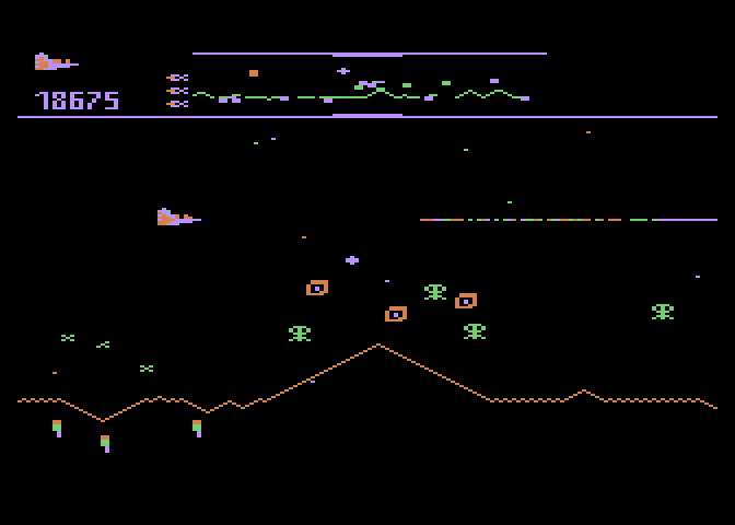Defender Atari 8-bit Screenshot: Those "x" patterns are mines left behind by some of the enemies...
