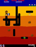 Dig Dug for Arcade - Attempting to drop a rock on a Pooka.