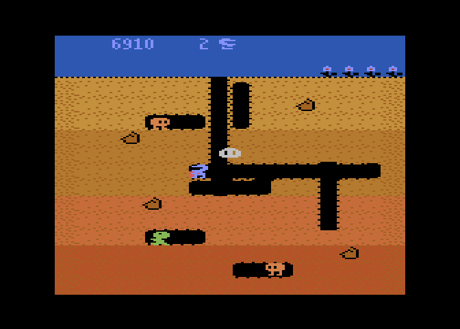 Dig Dug Atari 8-bit Screenshot: Opponents can change into ghosts to move through the dirt.
