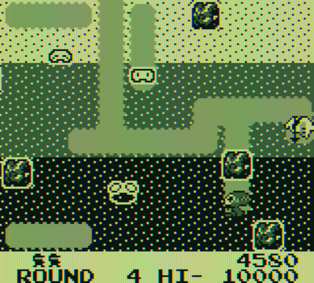 Dig Dug Game Boy Screenshot: Dropping a rock on a Fygar...