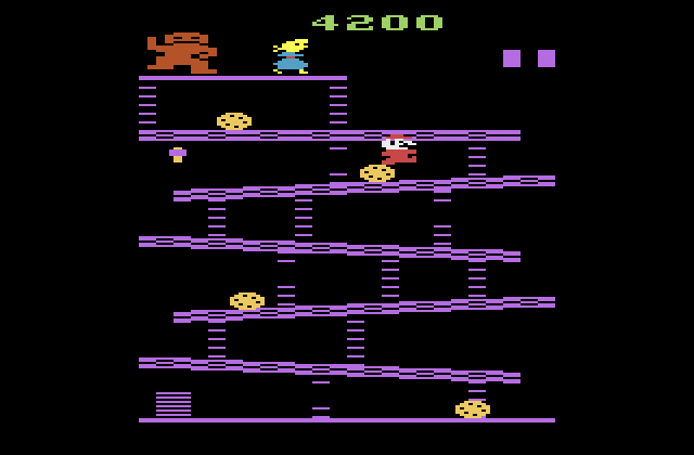 Donkey Kong Atari 2600 Screenshot: Jumping over a barrel.