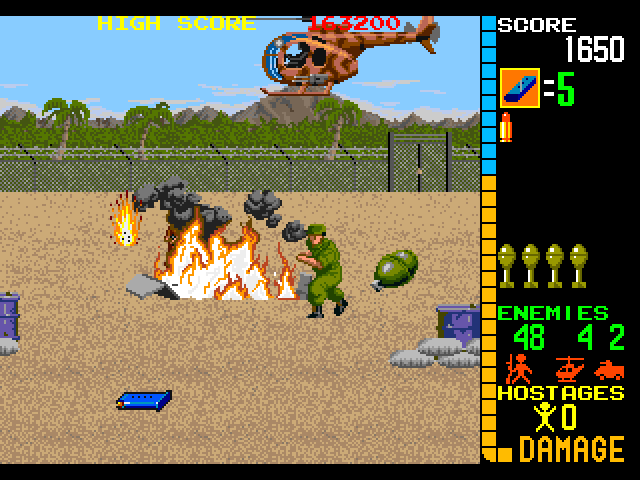 Operation Wolf Arcade Screenshot: Tank destroyed, but watch out for that helicopter!