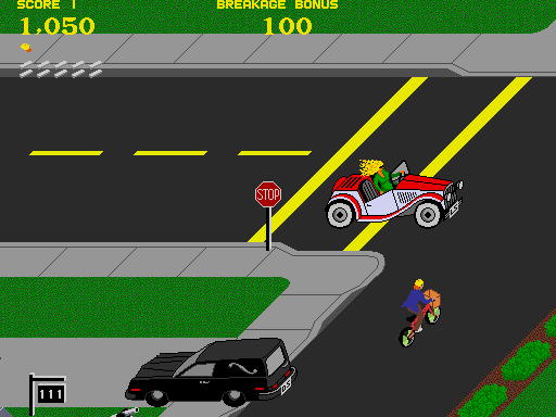 Paperboy Arcade Screenshot: Avoid the cars when crossing streets...