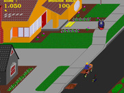 Paperboy for Arcade - This guy break dancing provides a target that earns bonus points.