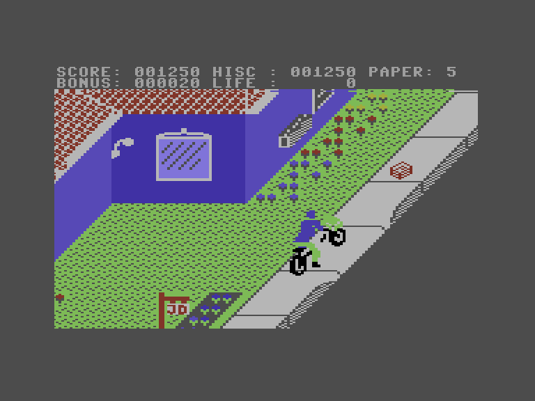 Paperboy Commodore 16 & Plus/4 Screenshot: Pick up the bundle of papers to replenish your supply.
