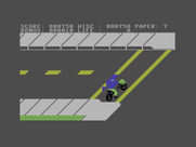 Paperboy for Commodore 16 & Plus/4 - Crossing a street; color clash is occasionally a problem in this version.