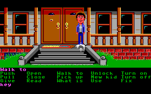 Maniac Mansion IBM PC/Compatibles Screenshot: Mansion front entrance. Someone left a key under the doormat!