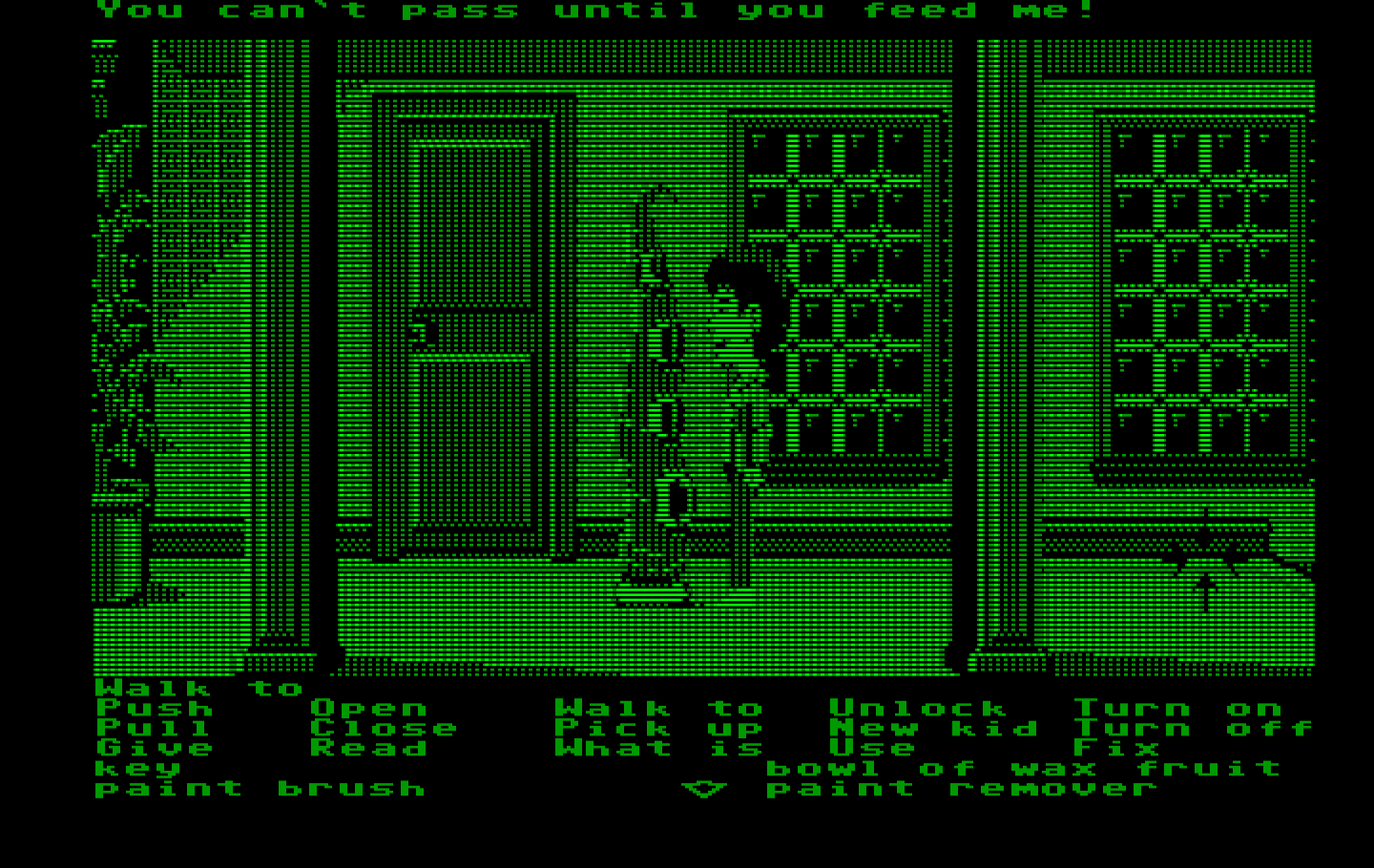 Maniac Mansion IBM PC/Compatibles Screenshot: Green tentacle won't let you pass unless you feed him.