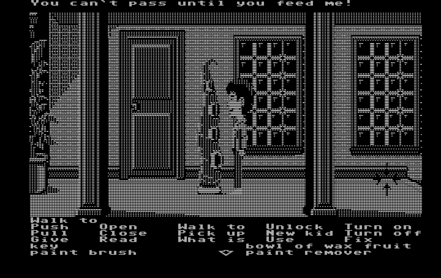 Maniac Mansion IBM PC/Compatibles Screenshot: Green tentacle won't let you pass unless you feed him.