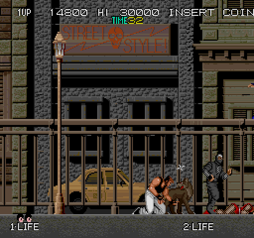 Bad Dudes vs. Dragon Ninja Arcade Screenshot: Oof, I'm hit!