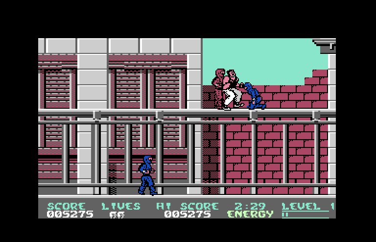 Bad Dudes vs. Dragon Ninja Commodore 64 Screenshot: Oof, I'm getting beat up!