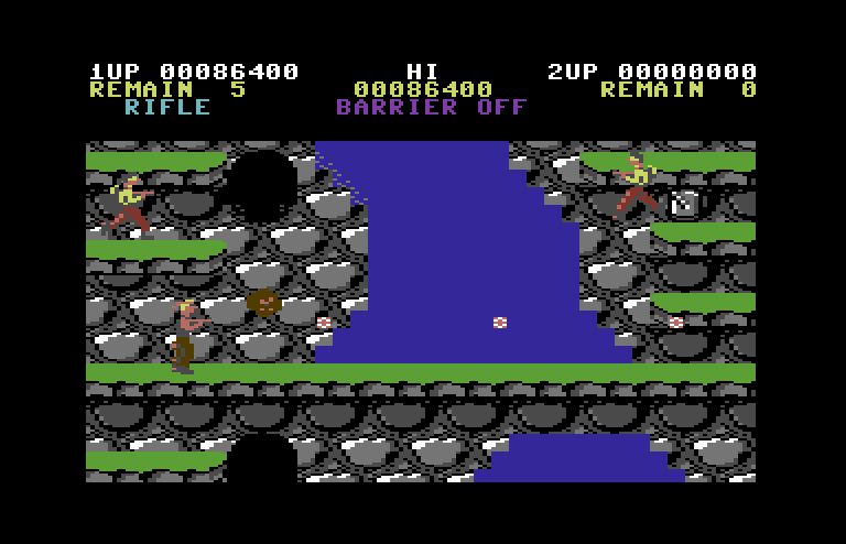 Contra Commodore 64 Screenshot: Avoid the boulders that fall out of those holes.