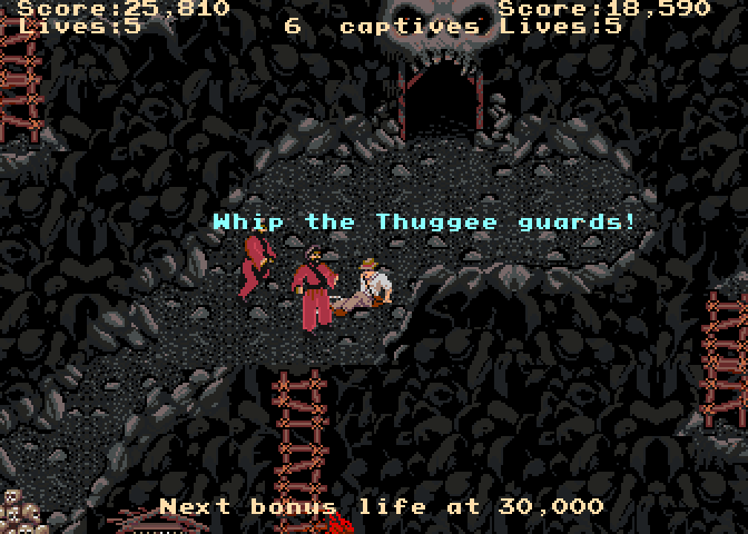 Indiana Jones and the Temple of Doom Arcade Screenshot: Whip the thuggee guards...