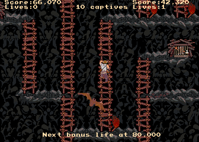 Indiana Jones and the Temple of Doom Arcade Screenshot: Climbing a ladder and attempting to escape a giant bat!