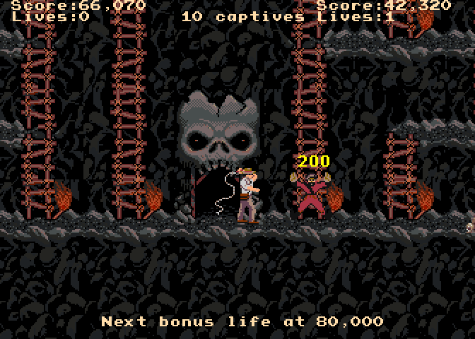 Indiana Jones and the Temple of Doom Arcade Screenshot: Whipping the guards temporarily stuns them...