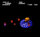 Alien Syndrome for NES / Famicom - Battle with the first end of level boss...